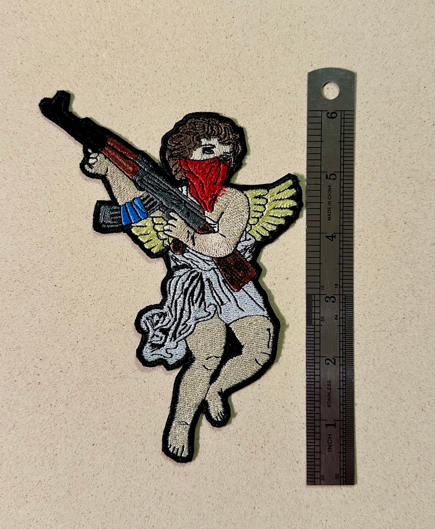 Guardian angel with an AK patch ￼