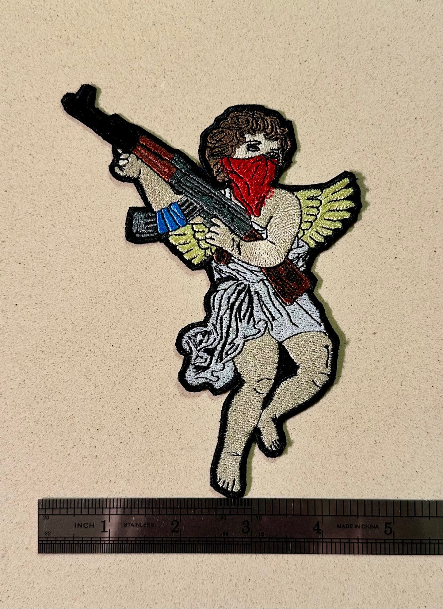 Guardian angel with an AK patch ￼